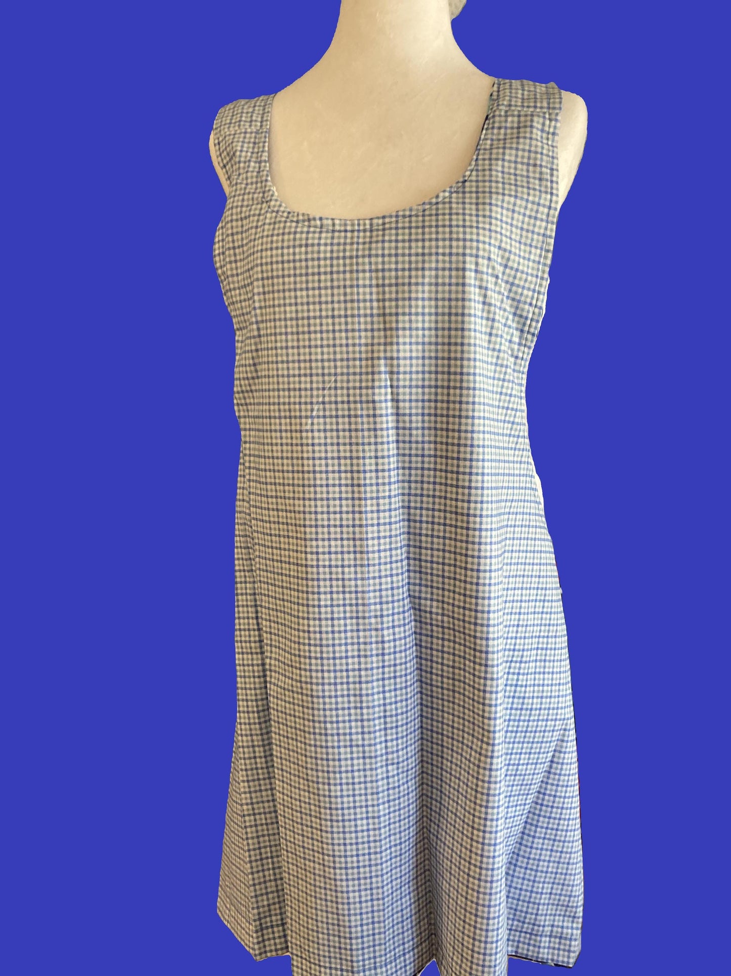 Mermaids swimming in blue water on an apron.