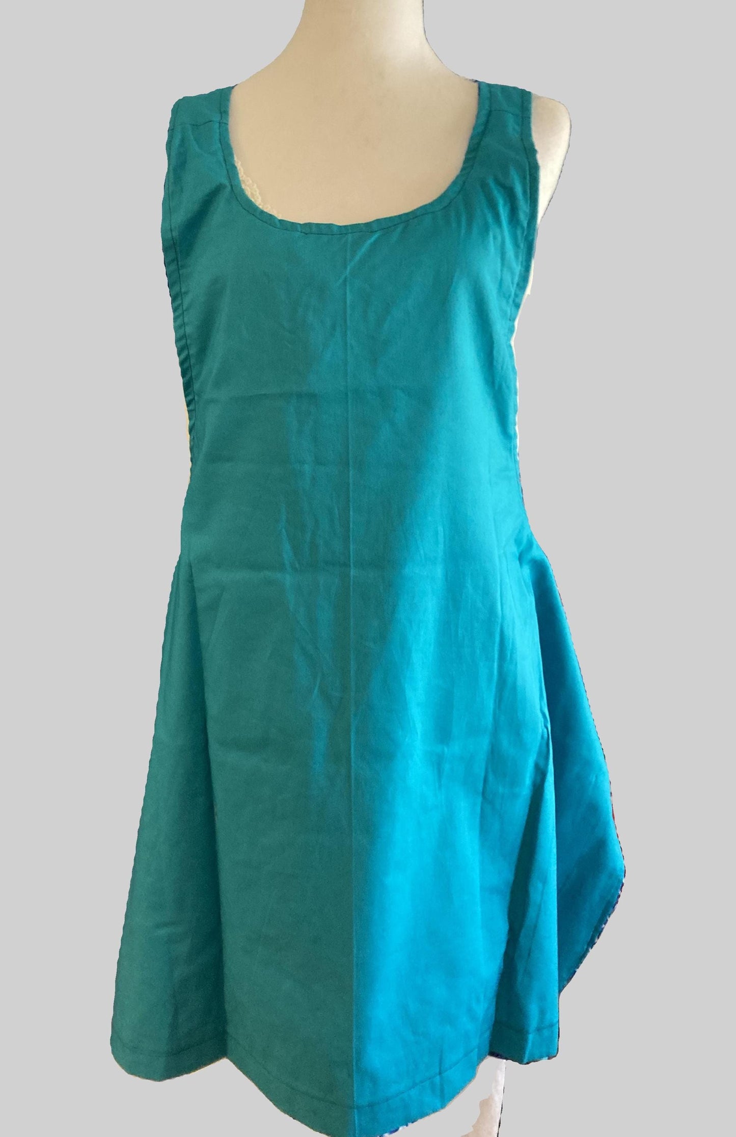 Mermaids swimming in blue water on an apron.